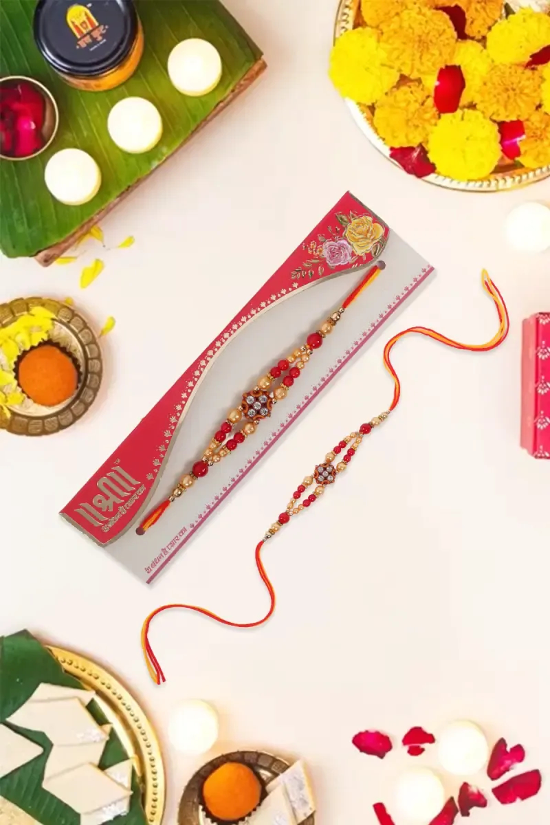 Golden & Red Beaded Rakhi with Floral Centerpiece